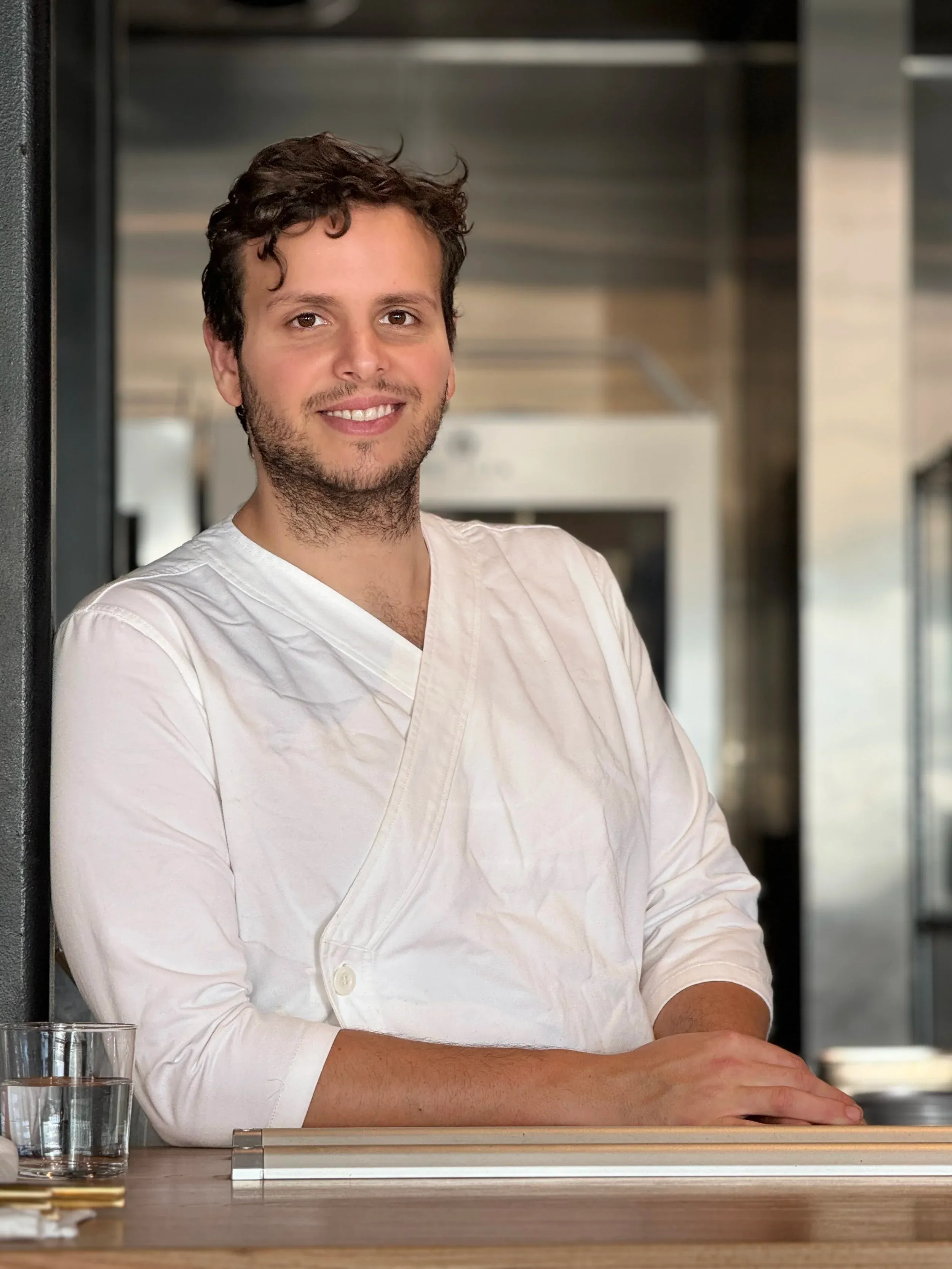 Chef Jacob Himmel plating a dish in a home kitchen